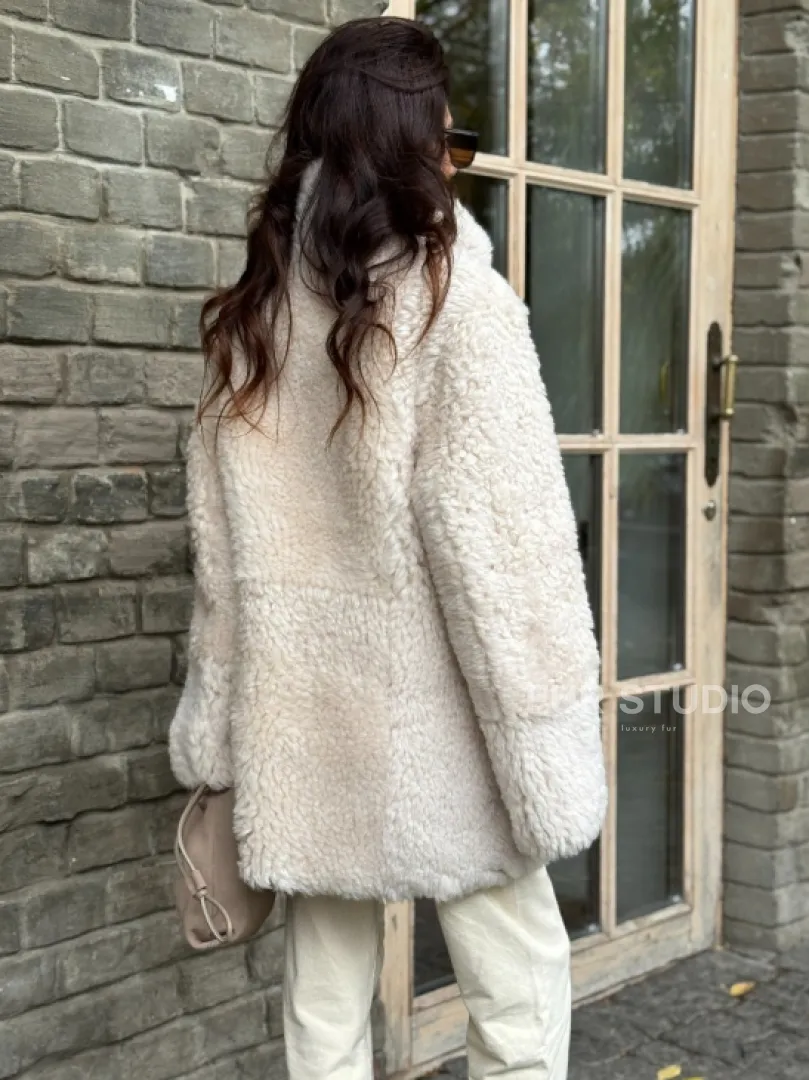 Женская дубленка - мех тиградо