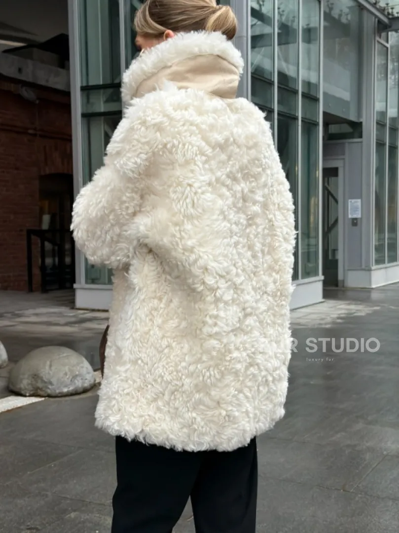 Белая шубка из тиградо