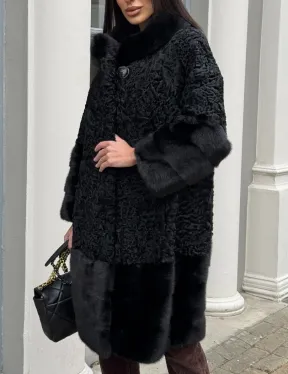 Черная шуба из меха каракульчи с отделкой из меха норки