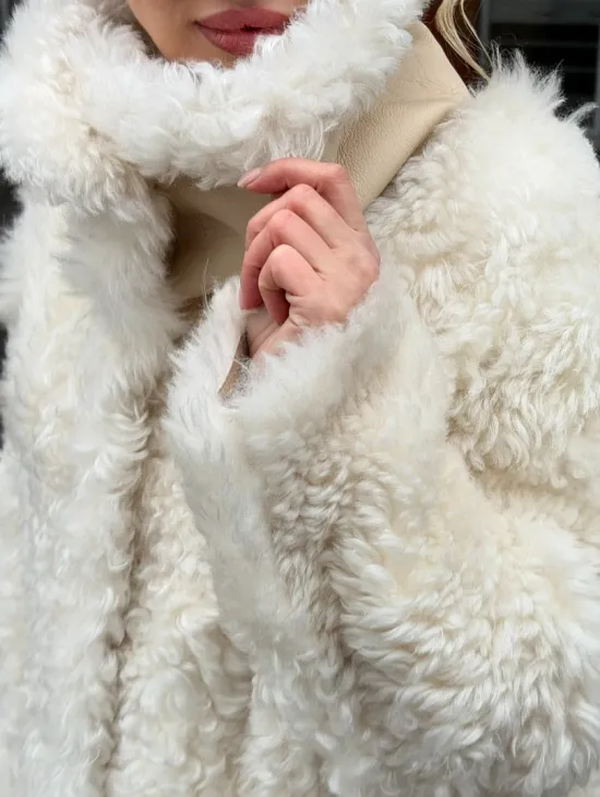 Белая шубка из тиградо