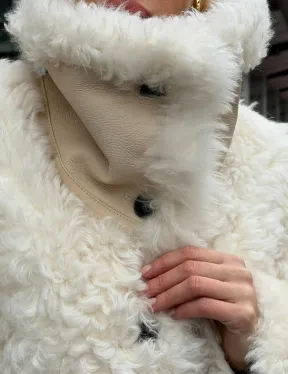 Белая шубка из тиградо