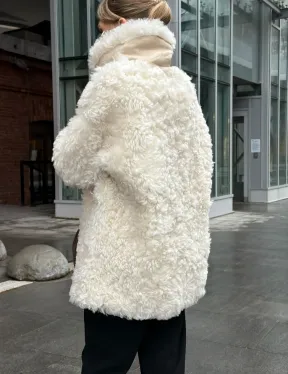 Белая шубка из тиградо