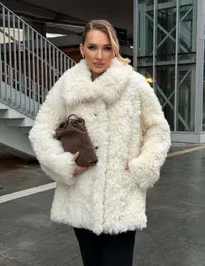 Белая шубка из тиградо